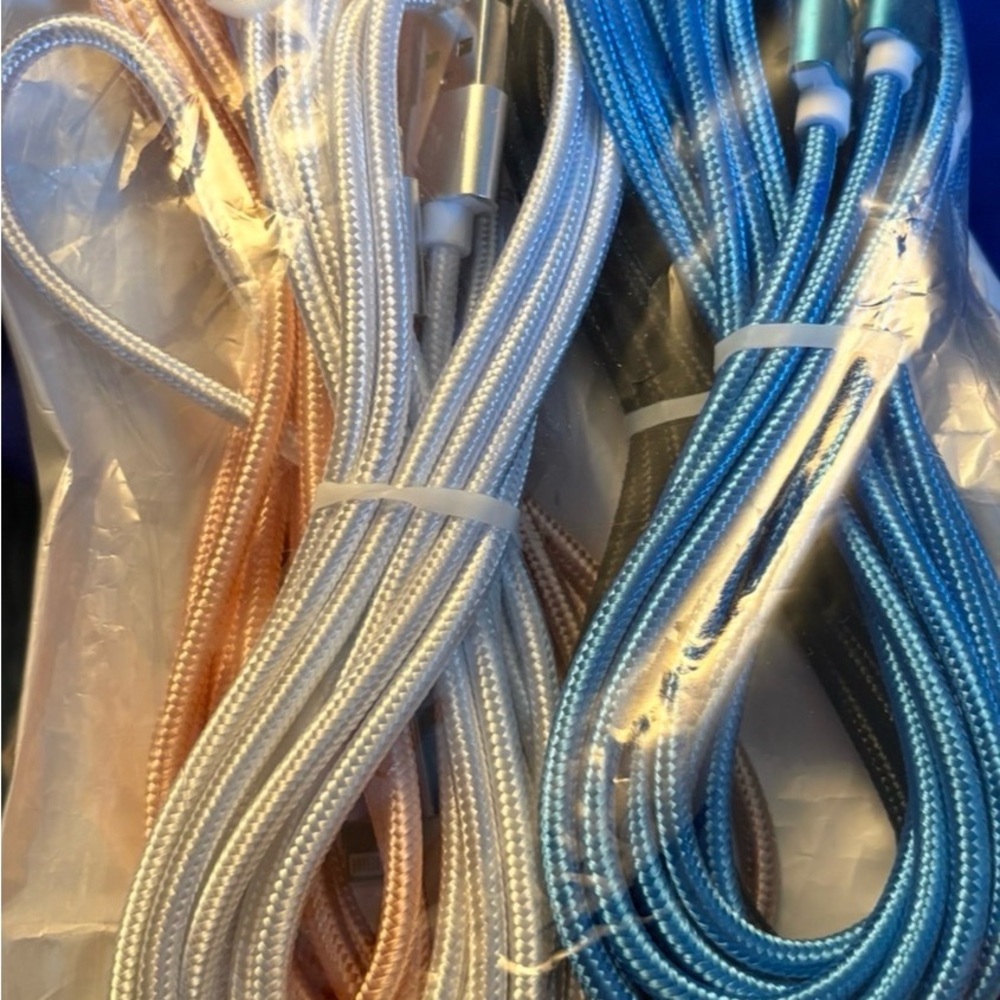 10 foot Braided Charging Cables in Blue, Silver, and Pink and black.